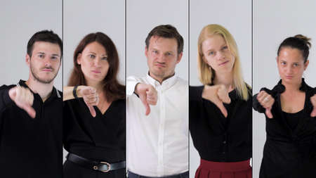 Business team disapproving and showing thumbs down.の写真素材