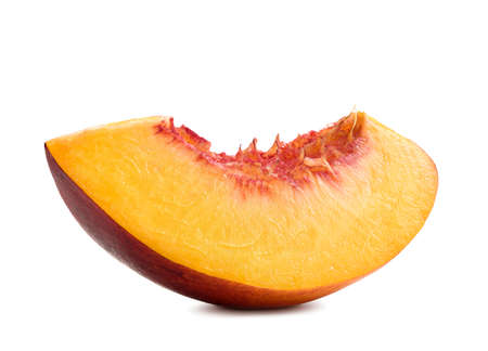 Fresh peach isolated. Organic nectarine or peach slice on white background.の写真素材