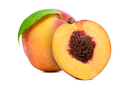 Fresh peach isolated. Organic nectarine or peach slice with leaf on white background.の写真素材
