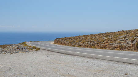 Mountain road by the seaの写真素材