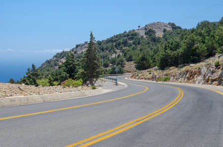 Mountain road by the seaの写真素材