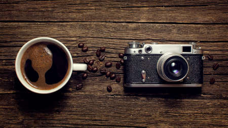 Cup of coffee and the old cameraの写真素材