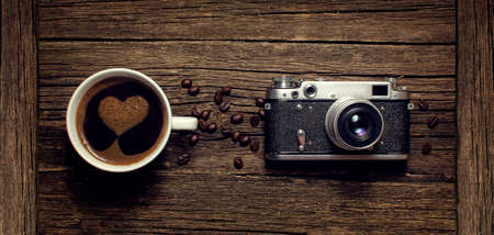 Coffee cup and old cameraの写真素材