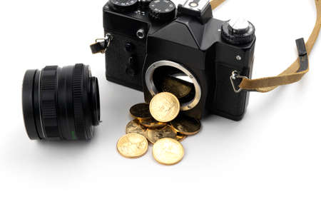 camera with dollars pouring from it on a white backgroundの写真素材
