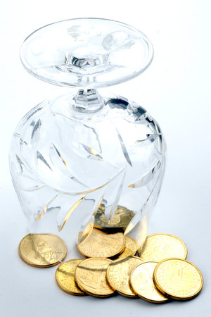 coins of 1 dollar are poured from the glassの写真素材