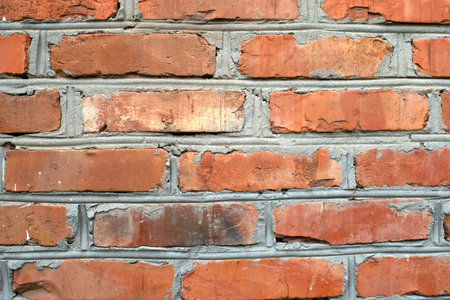 image of a section of an old red brick wall for a background or texture