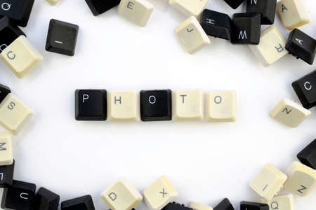computers and computer technologies in industries and fields of human activity - concept. a photo. The word is laid out on a white background from the scattered keys of the computer keyboard - photoの写真素材