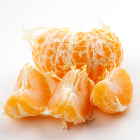 Slices of juicy tangerine isolated on white backgroundの写真素材