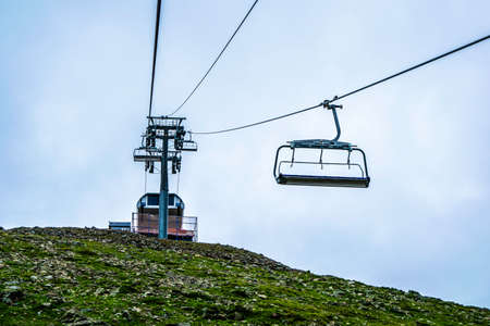 cable car on a mountain slope cable cars running up and downの写真素材
