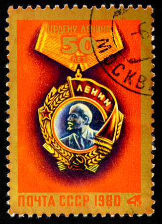 10.24.2019 Divnoe Stavropol Territory Russia 1980 postage stamp of the USSR Order of Lenin 50 years Order of Lenin on a red backgroundのeditorial素材