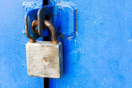 old iron castle on a blue iron gateの写真素材