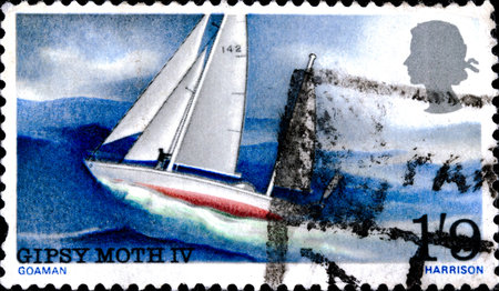 02.09.2020 Divnoe Stavropol Krai Russia postage stamp Great Britain 1967 One-Man Voyage Around the World by Sir Francis Chichester Gipsy Moth IV sailing yacht on the high seasのeditorial素材