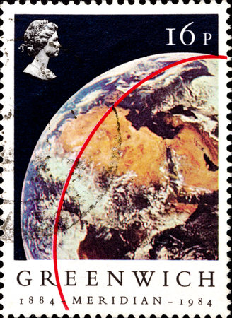 02 10 2020 Divnoe Stavropol Krai Russia postage stamp Great Britain 1984 The 100th Anniversary of the Greenwich Meridian View of Earth from 'Apollo 11' Meridian red stripeのeditorial素材