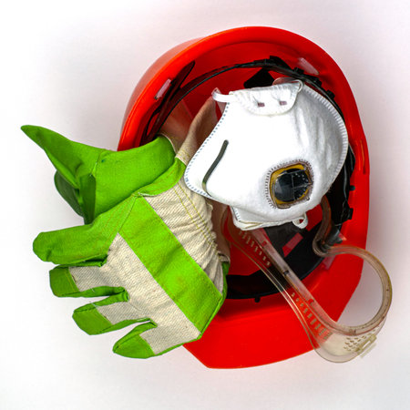 protective equipment work helmet gloves goggles and respirator on a white background