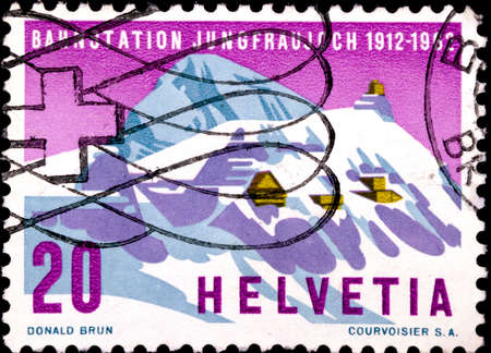 02 08 2020 Divnoe Stavropol Territory Russia postage stamp Switzerland 1962 Events 50th anniversary. of the railroad station on the Jungfrau mountain 1912-1962 Mountain Station Jungfraujoch Jungfrauloch mountain M nchのeditorial素材