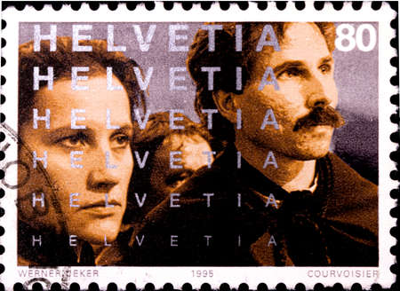 02 08 2020 Divnoe Stavropol Krai Russia the postage stamp Switzerland 1995 The 100th Anniversary of the Cinema Scene from Anna Goldin - Letzte Hexe people close-upのeditorial素材