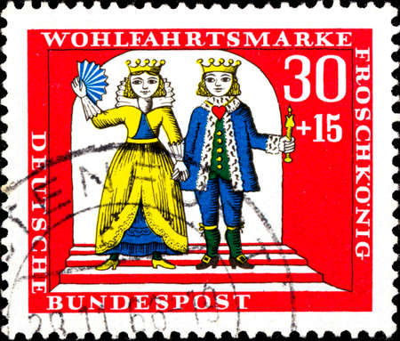 02 10 2020 Divnoe Stavropol Krai Russia postage stamp Germany West Berlin 1966 Charity Stamps Tales of the Brothers Grimm Scene from the fairy tale 'The Frog Prince' prince and princess hold hands.のeditorial素材