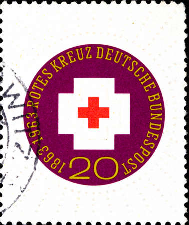 02 10 2020 Divnoe Stavropol Territory Russia postage stamp Germany 1963 The 100th Anniversary of the International Red Cross 1863-1963 logo on a white backgroundのeditorial素材