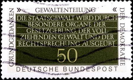 02 10 2020 Divnoe Stavropol Territory Russia Germany postage stamp 1981 Information About Politics Fundamental Concepts of Democracy Separation of Powers quote in German on a green backgroundのeditorial素材
