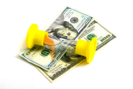 the concept of time-money on hundred-dollar bills is an hourglass. High quality photoの写真素材