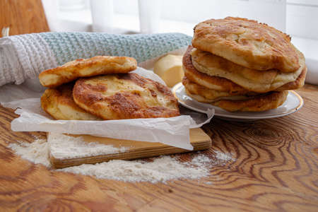 homemade cheese pies are on the kitchen table. High quality photoの写真素材
