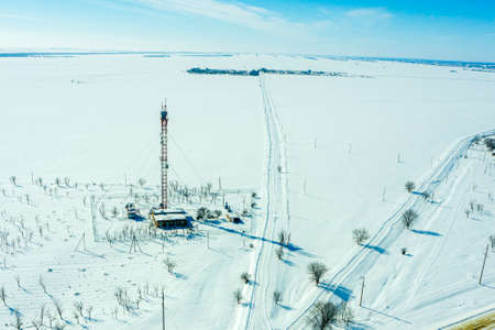 TV tower in the winter snow-covered steppe. High quality photoの写真素材
