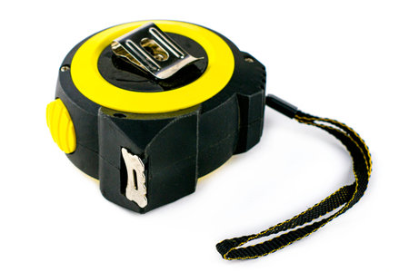 construction meter - tape measure isolated on a white background. High quality photo