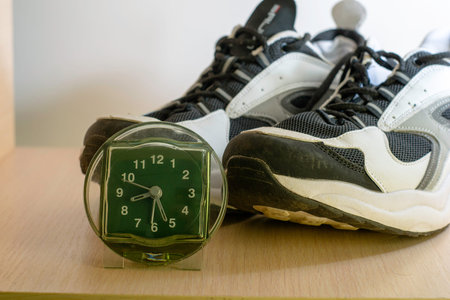 the concept of a healthy lifestyle watch stand side by side with sneakers. High quality photoの写真素材