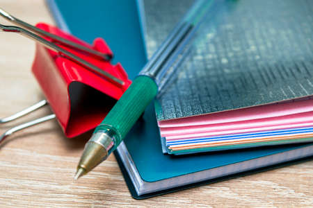 two notepads a fountain pen and a stationery clip close up. High quality photoの写真素材