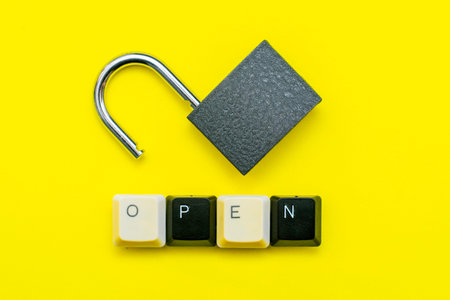 open lock on a yellow background the word open concept is laid out from the bottom of the computer...