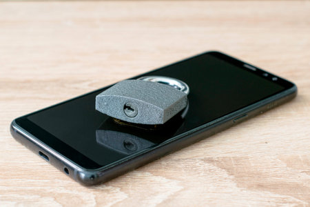 closed padlock on smartphone concept data protection. High quality photo
