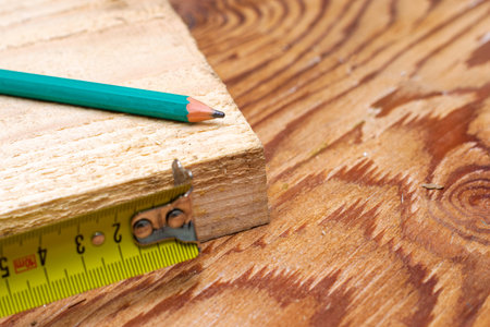 measuring tape pencil and fosca on the workbench concept craft construction. High quality photo