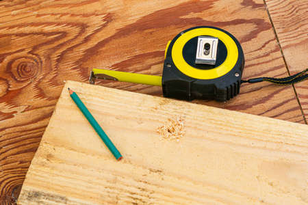 measuring tape pencil and fosca on the workbench concept craft construction. High quality photoの写真素材