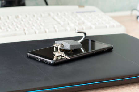 open iron lock with keys on smartphones and laptops the concept of information protection Internet censorship fotoの写真素材