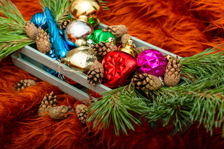 wooden box with pine twigs Christmas decorations and pine cones. High quality photoの写真素材