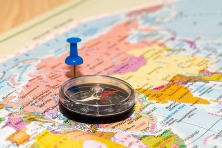 compass lying on the map the button marks the place of travel concept tourism. High quality photoの写真素材