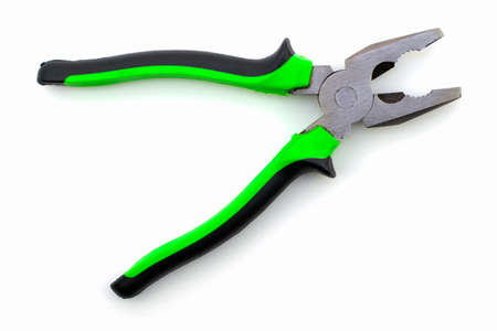 metal pliers with dielectric handles on a white background. High quality photoの写真素材