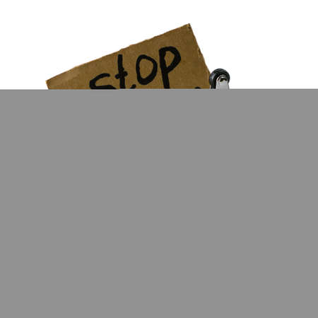 the concept of refusing to buy reasonable consumption is an inverted shopping cart with a padlock and a sign with the inscription stop shopping on a white backgroundの写真素材