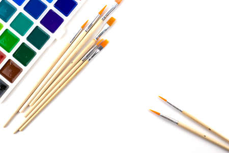 watercolor paints and brushes on a white background. High quality photoの写真素材