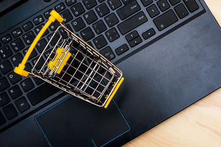 shopping cart on laptop keyboard concept of online trading cyber monday. High quality photoの写真素材