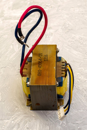 electric transformer with protruding wires on the table surface. High quality photo