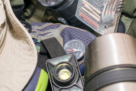 Backpack Matches Sneakers Hat Thermos Compass Folding Flashlight and Cutlery Travel Concept Tourist. High quality photoの写真素材