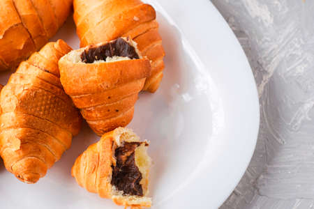 fresh croissants on a white plate copyscape. High quality photoの写真素材