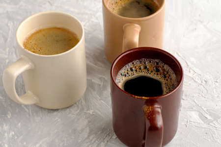 three mugs of coffee on the table. High quality photoの写真素材