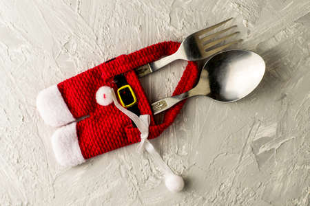 cutlery spoon and fork wrapped in santa claus pants. High quality photoの写真素材