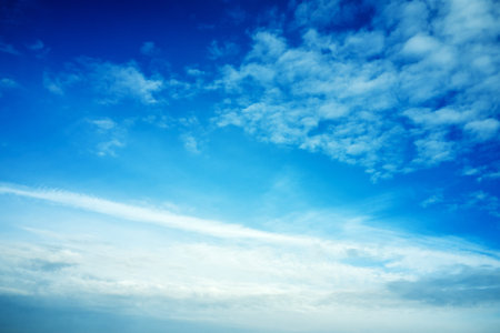 blue cloudy sky on a sunny day background screensaver backdrop. high quality photo