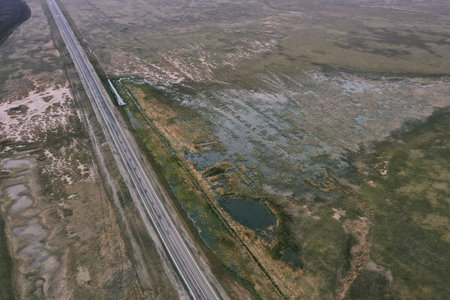 steppe landscape road and lake in the steppe and blue sky. high quality photo