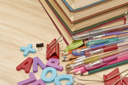 letters books pencils fountain pens brushes stationery clips on the table concept education business...