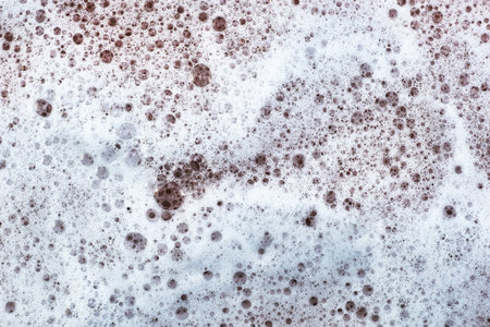 soap foam on pink foch texture background backdrop. high quality photoの写真素材