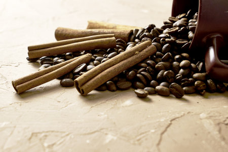 coffee beans with cinnamon and a coffee mug on the table with a copy space. high quality photoの写真素材